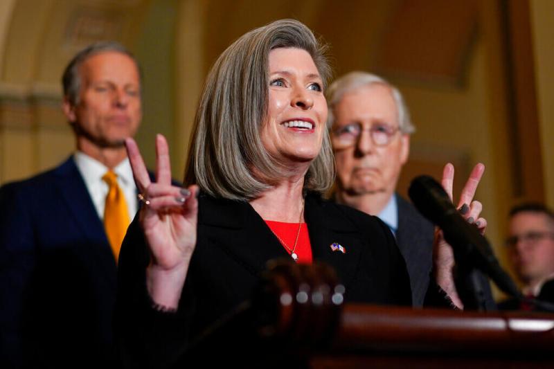 US Sen. Joni Ernst of Iowa speaks at a podium