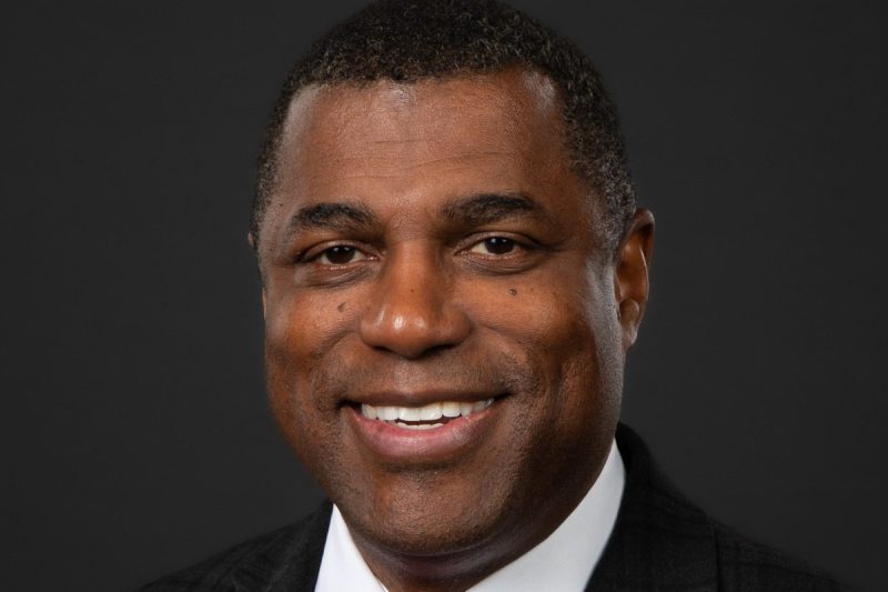 Eddie Andrews' official portrait. A smiling Black man.
