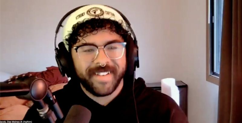 Jacob Scroggins, a shift supervisor at the Des Moines Starbucks and a strike captain at his store, appears in a screenshot from a video call with Iowa Starting Line’s Amie Rivers. (Amie Rivers/Iowa Starting Line)